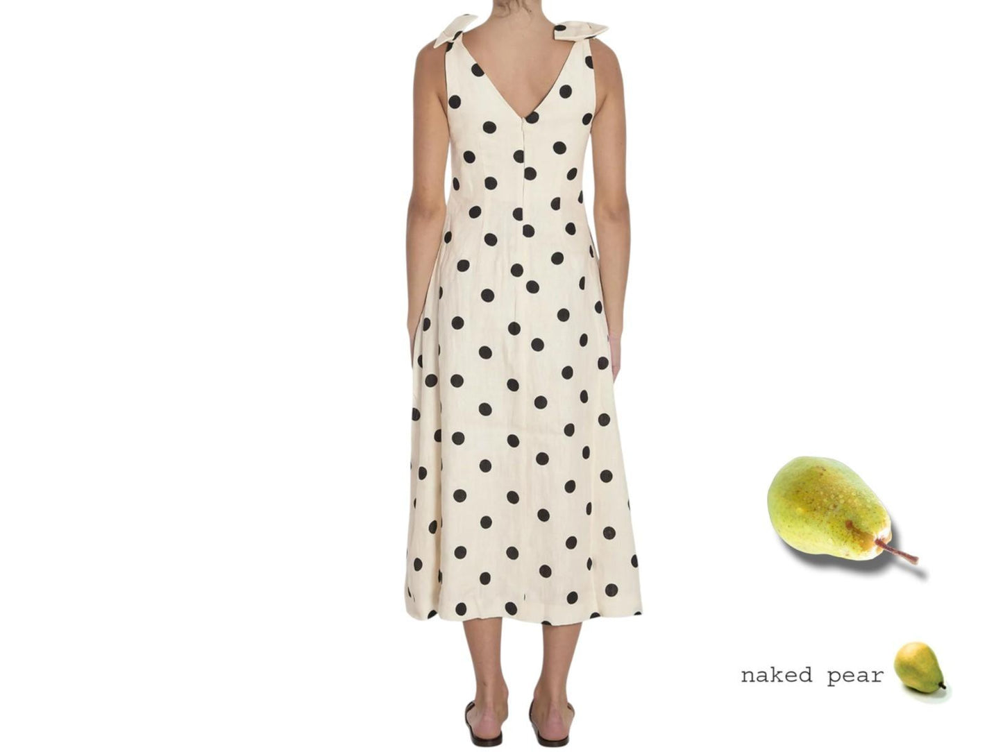 Woman wearing a polka dot dress with a naked pear graphic on a white background