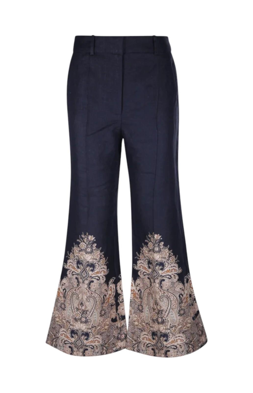 Navy blue pants with floral embroidery on a white background