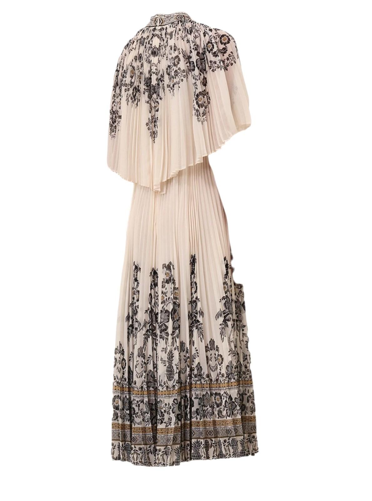 Beige dress with black floral patterns on a white background