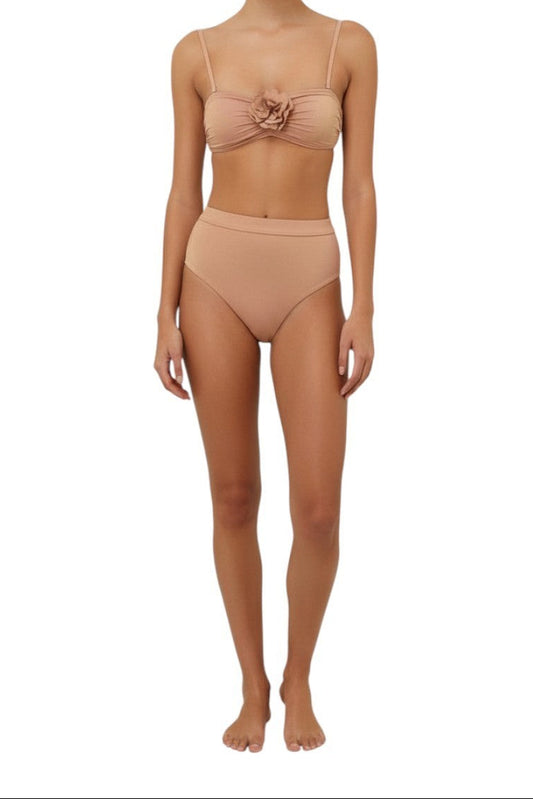 AI generated image of Woman wearing a beige bikini set on a white background