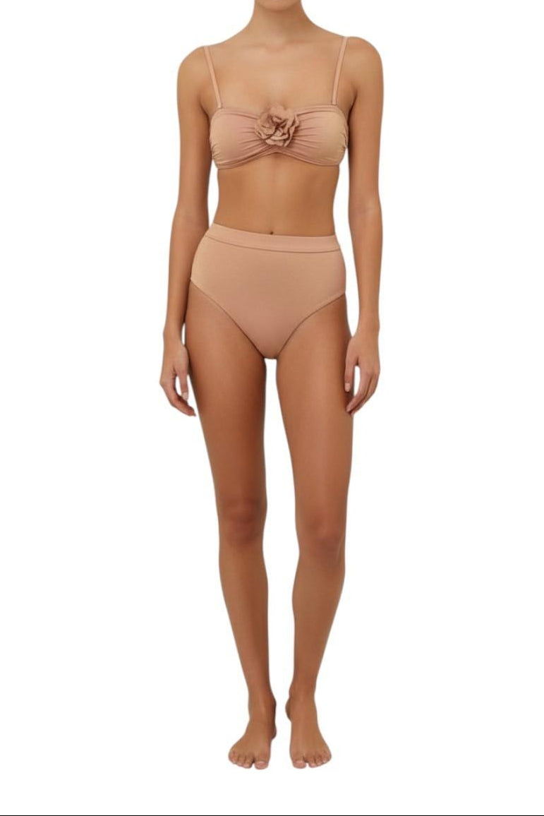 AI generated Woman wearing a beige bikini set on a white background