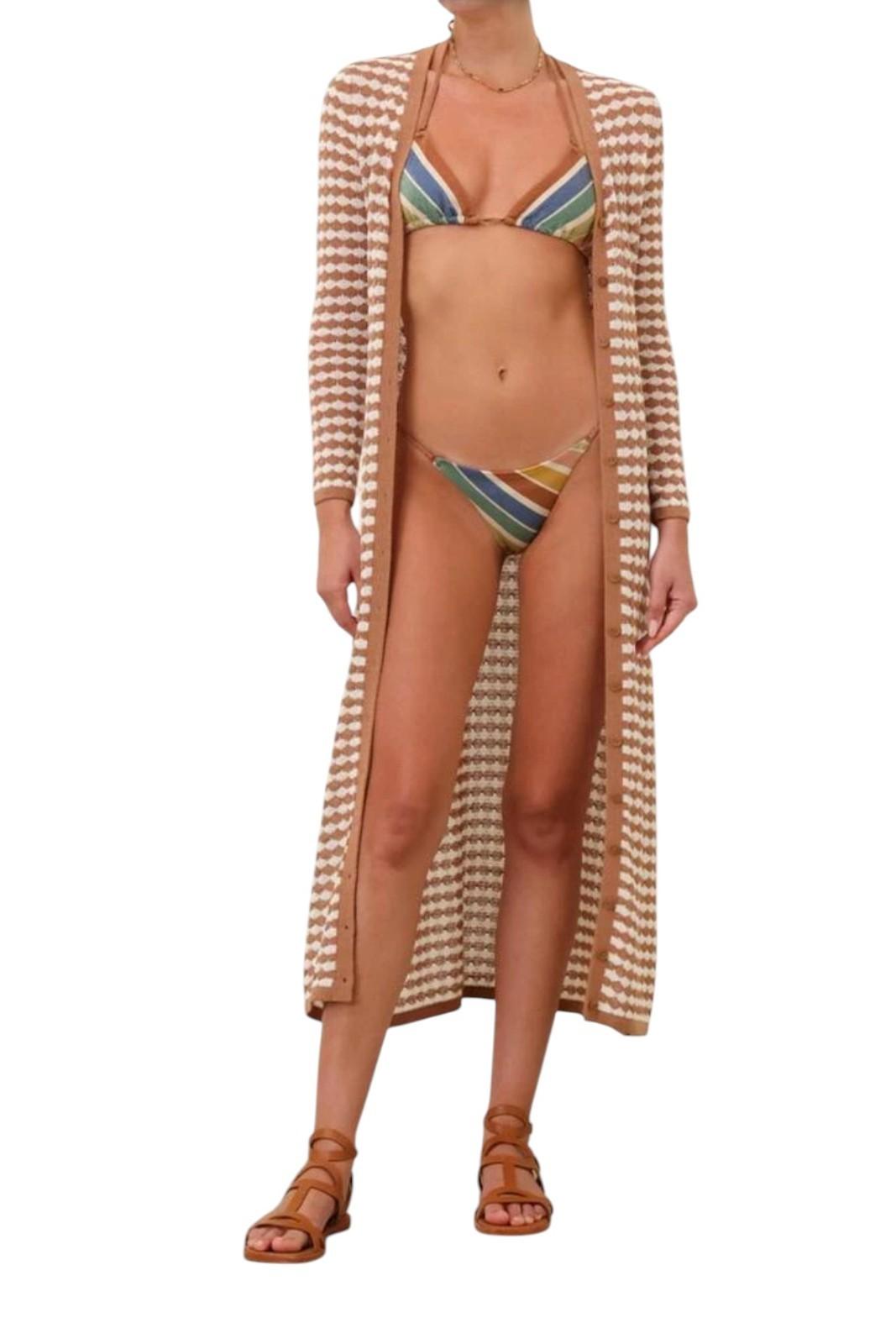 Woman wearing a colorful bikini with a matching long cover-up on a white background