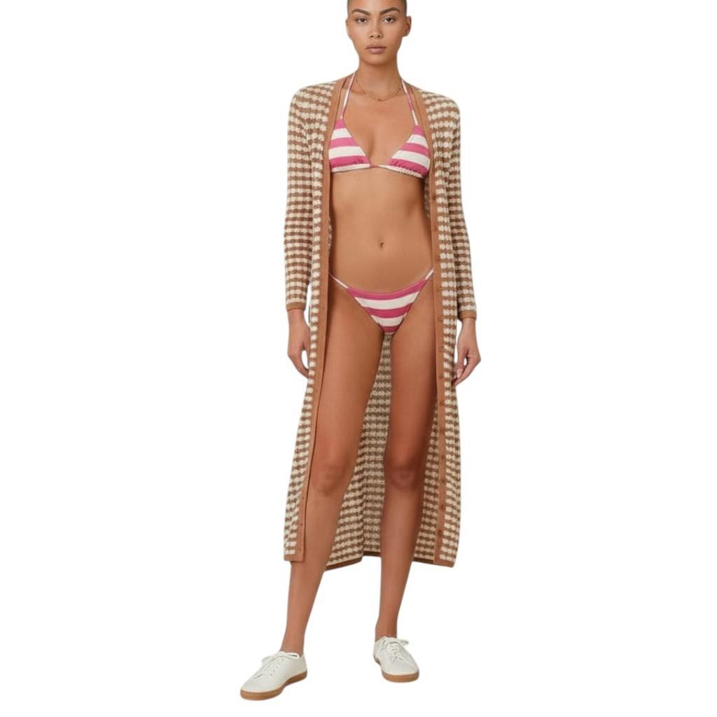 AI generated image of Woman wearing a striped bikini and checkered cover-up on a white background