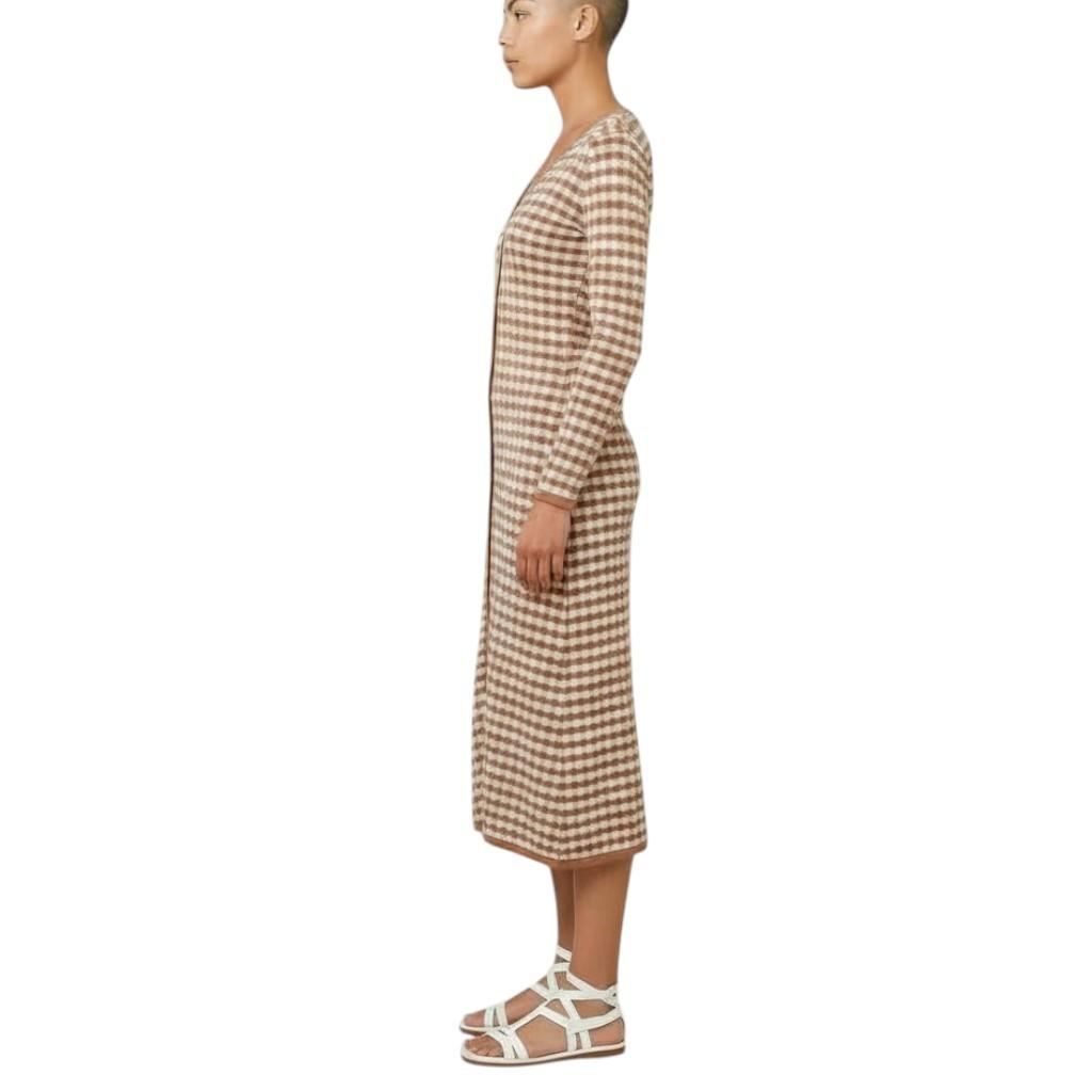 Person wearing a checkered dress on a white background