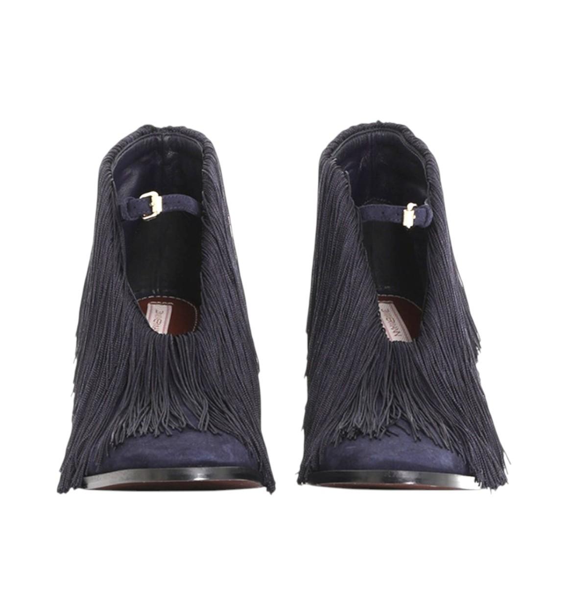 Pair of dark blue fringed shoes on a white background