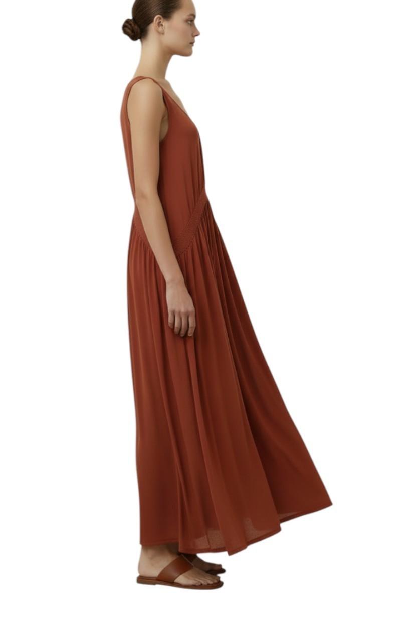 AI generated image of Woman wearing a rust-colored dress on a white background