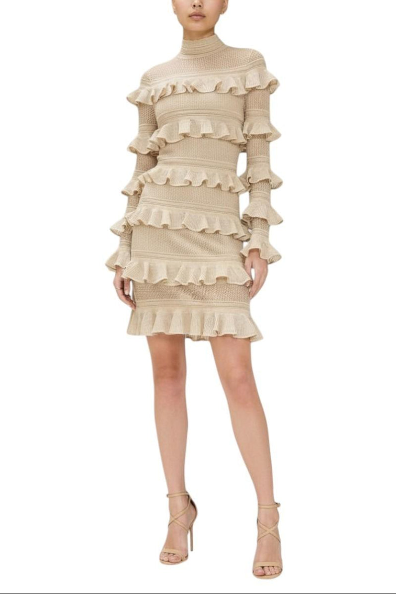 Beige ruffled dress worn by a model on a white background