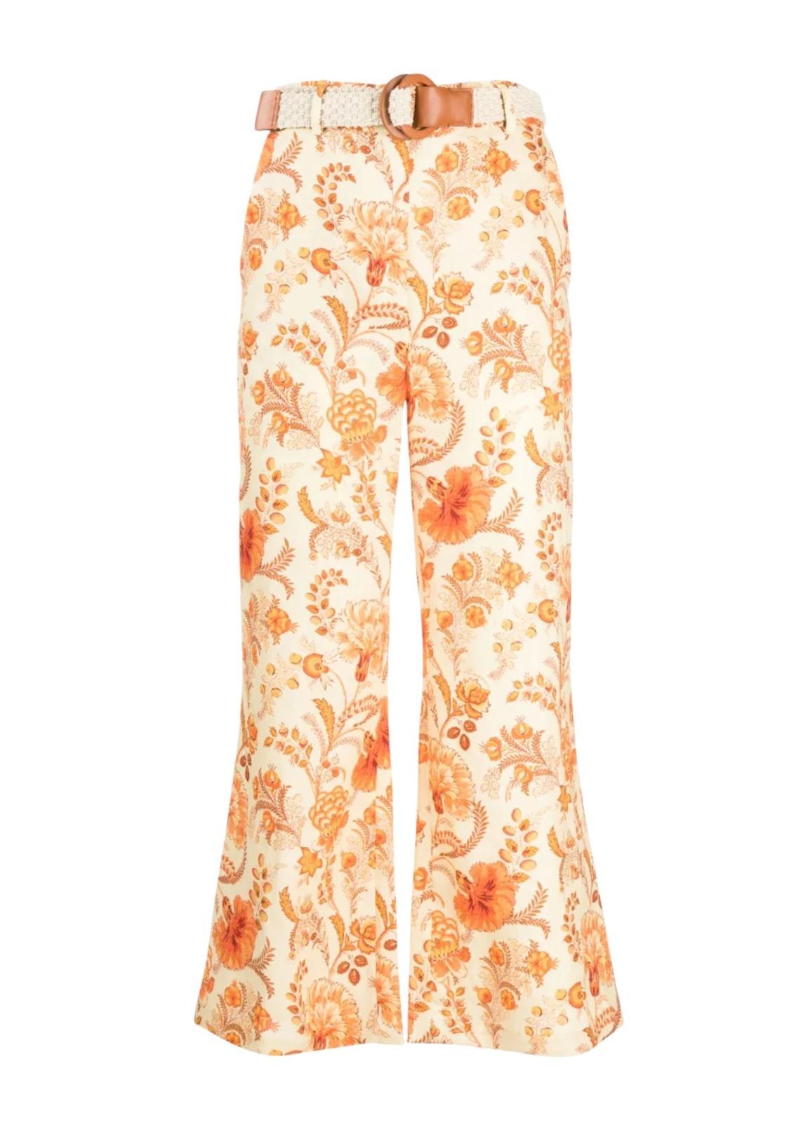 Floral patterned pants with a belt on a white background