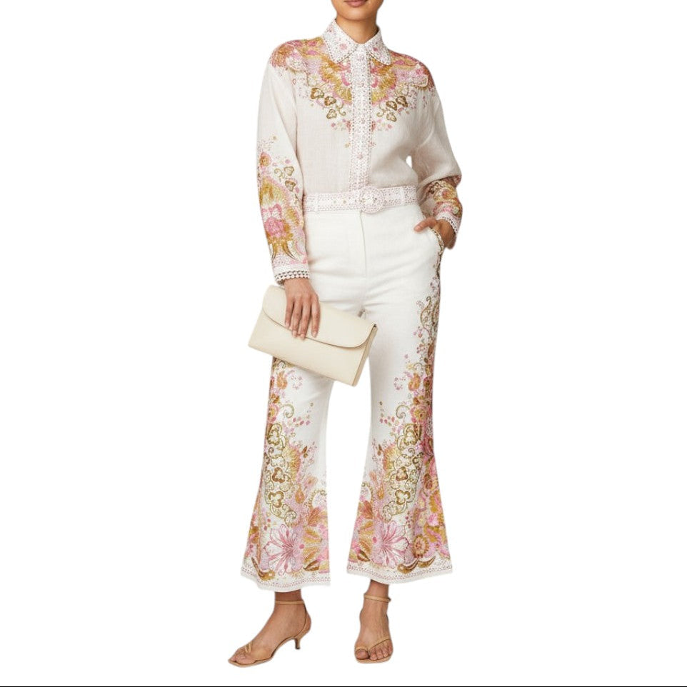 AI generated image of Woman wearing a floral embroidered outfit with a white background