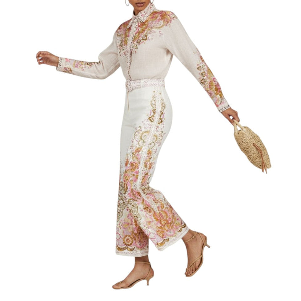 Woman wearing a floral outfit with a white background