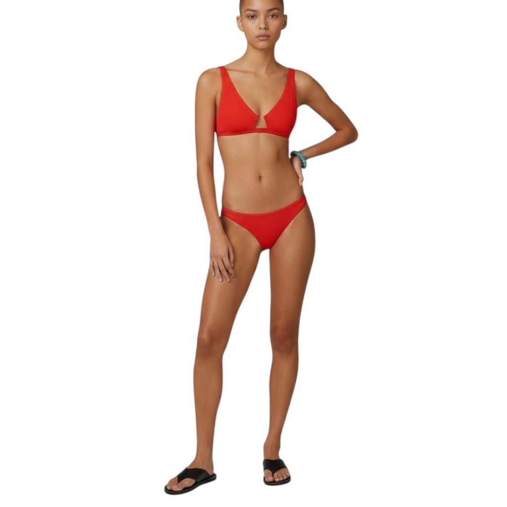AI generated image of Woman wearing a red bikini on a white background
