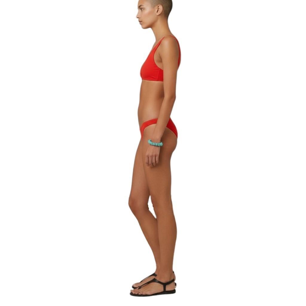AI generated image of Woman wearing a red bikini on a white background