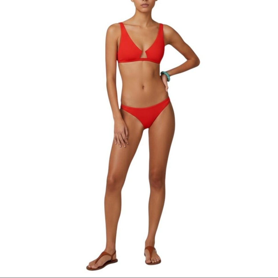 Woman wearing a red bikini on a white background