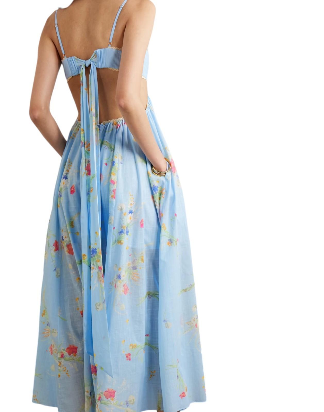 Light blue floral dress with thin straps on a white background