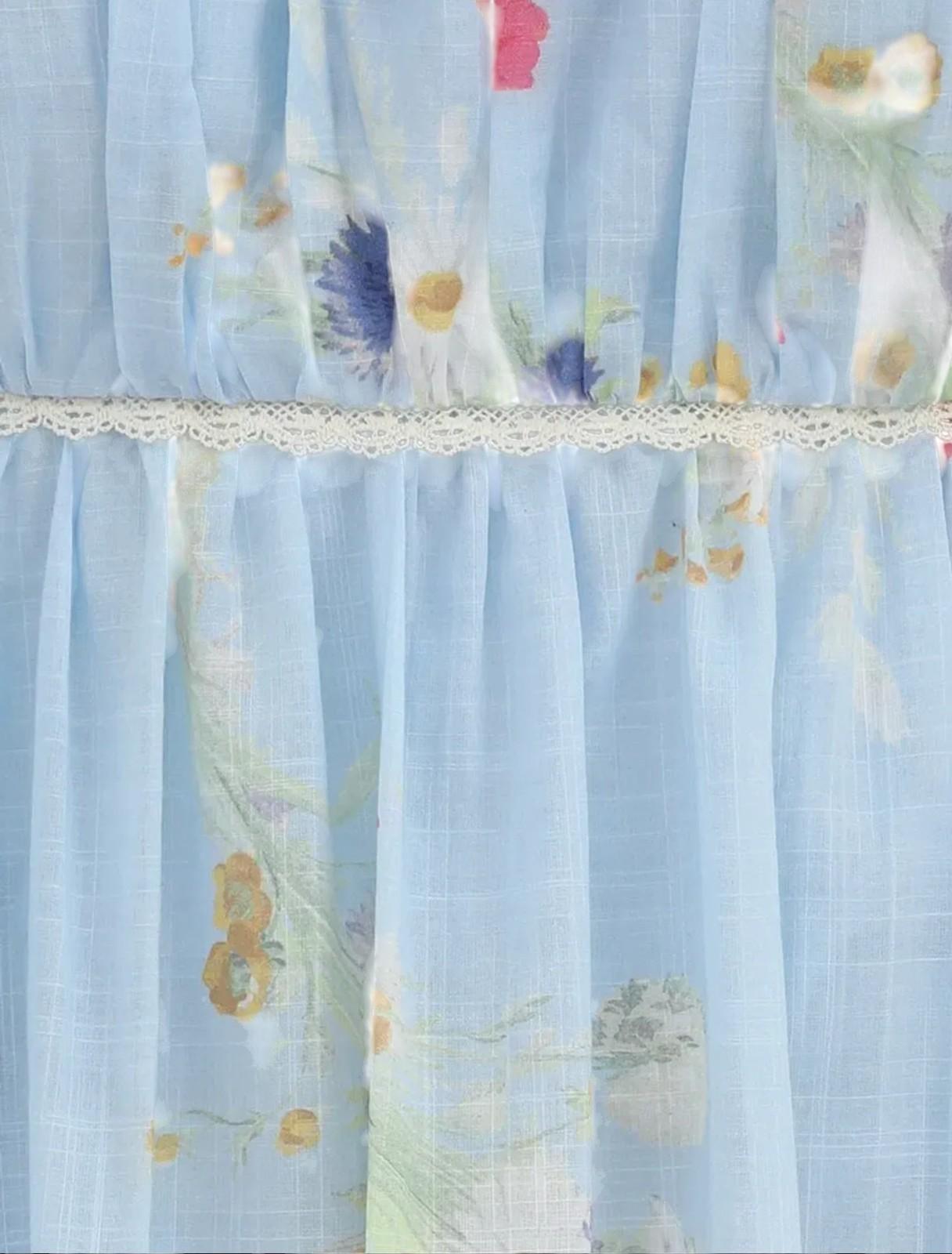 Light blue floral curtain with lace trim