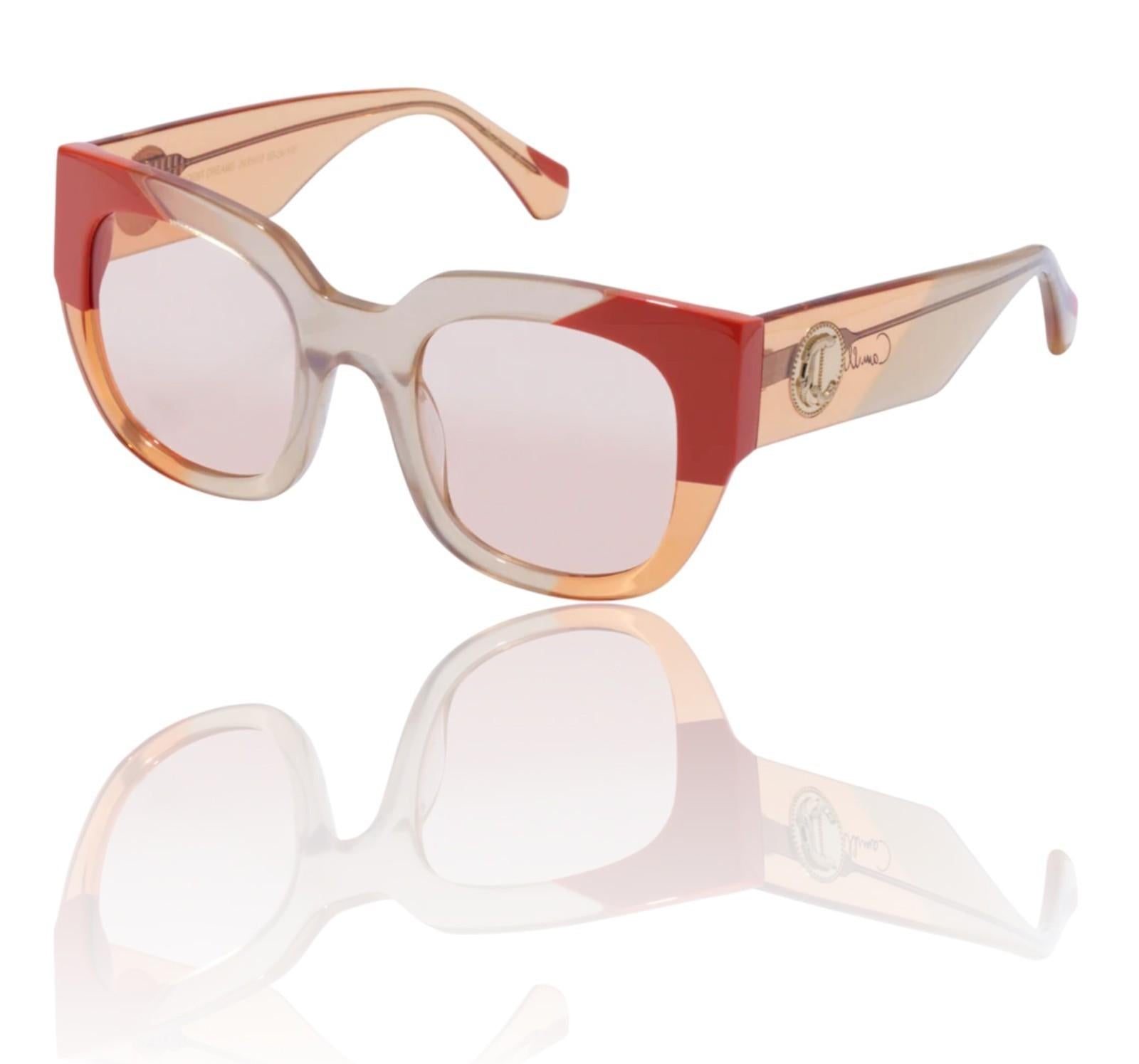 Sunglasses with red and beige frame on a white background