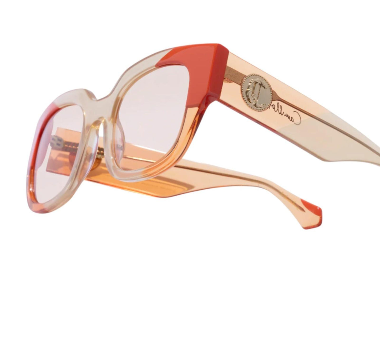 Sunglasses with red and beige frame on a white background