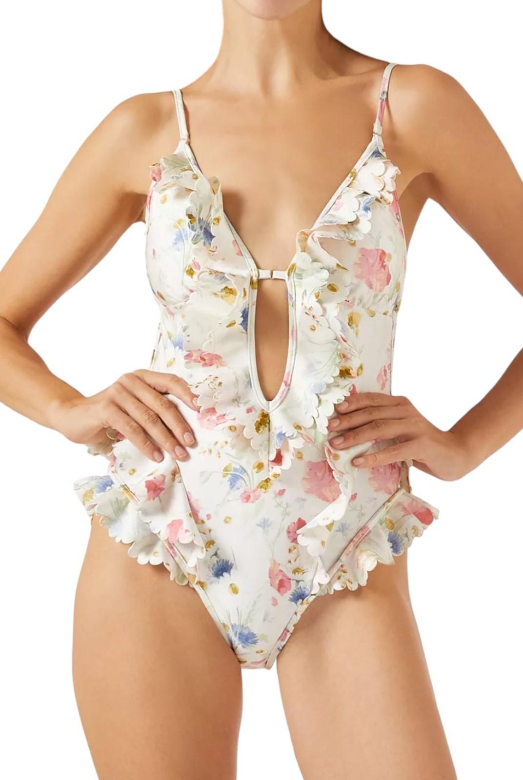 Floral one-piece swimsuit worn by a model on a white background