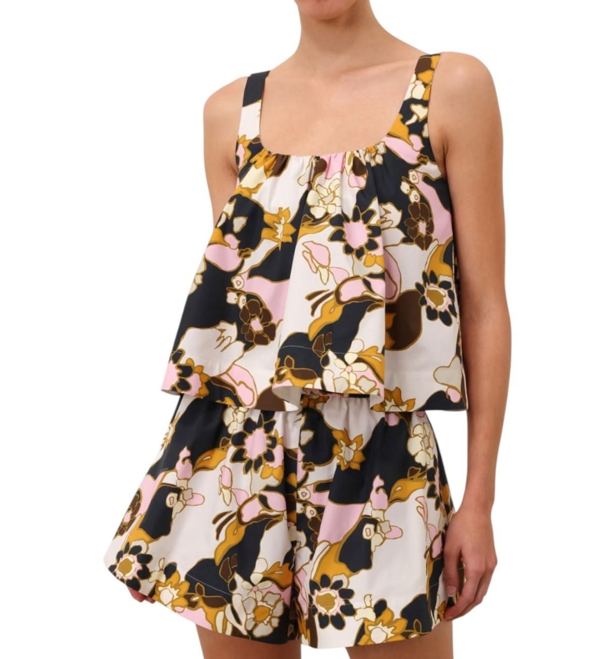 Woman wearing a floral dress with a white background