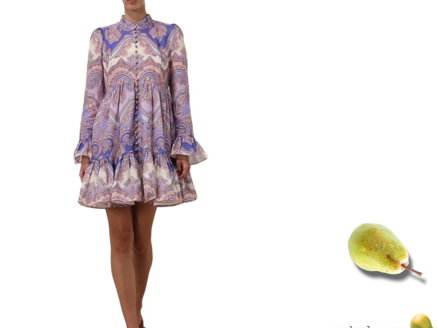 Woman wearing a patterned dress with a pear graphic labeled 'naked pear' on a white background