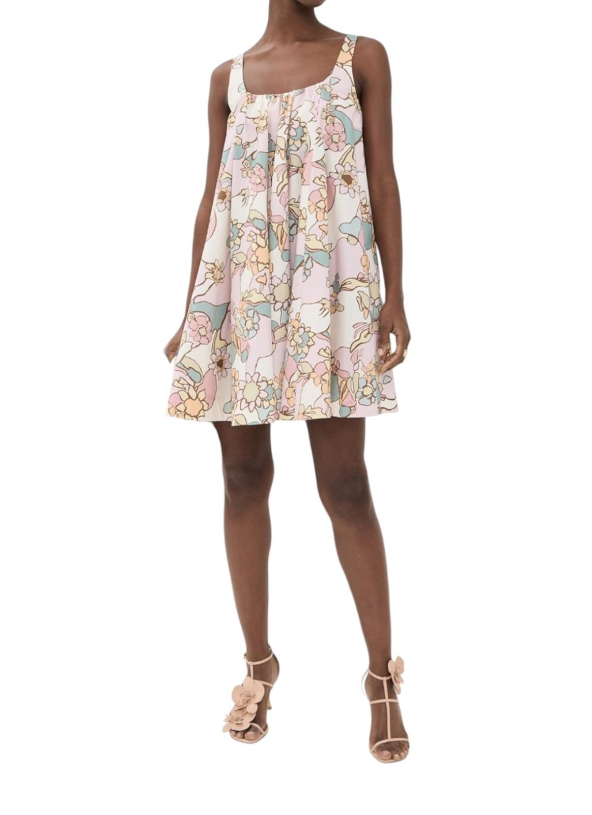 Woman wearing a floral dress on a white background