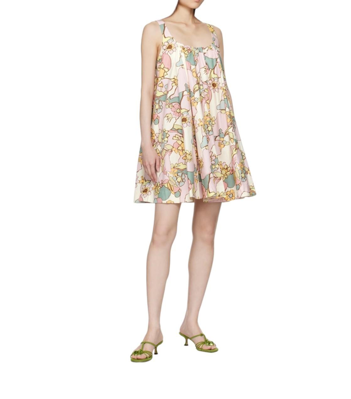Woman wearing a floral dress on a white background
