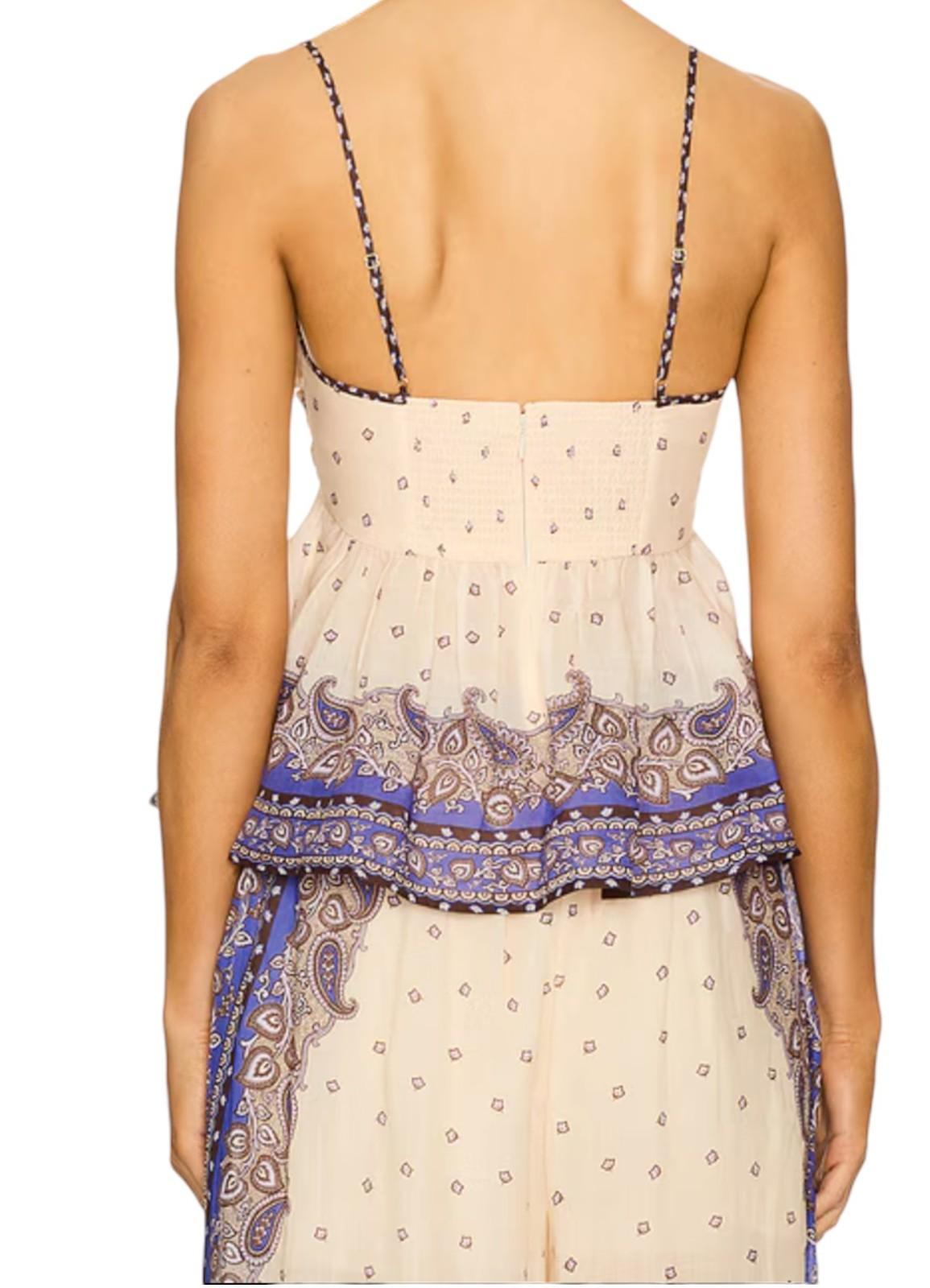 Beige and purple patterned top with thin straps on a white background