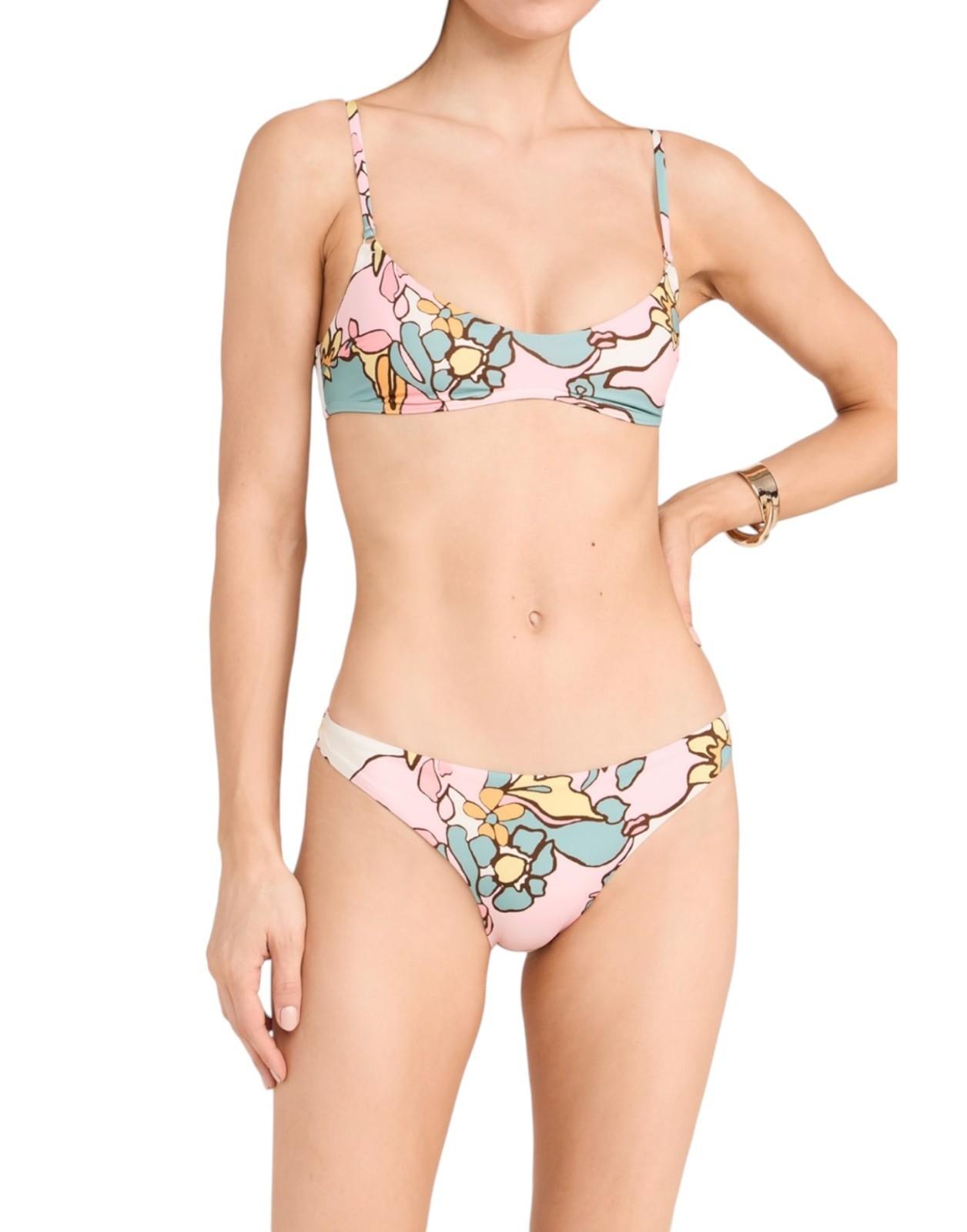 Woman wearing a floral bikini set on a white background