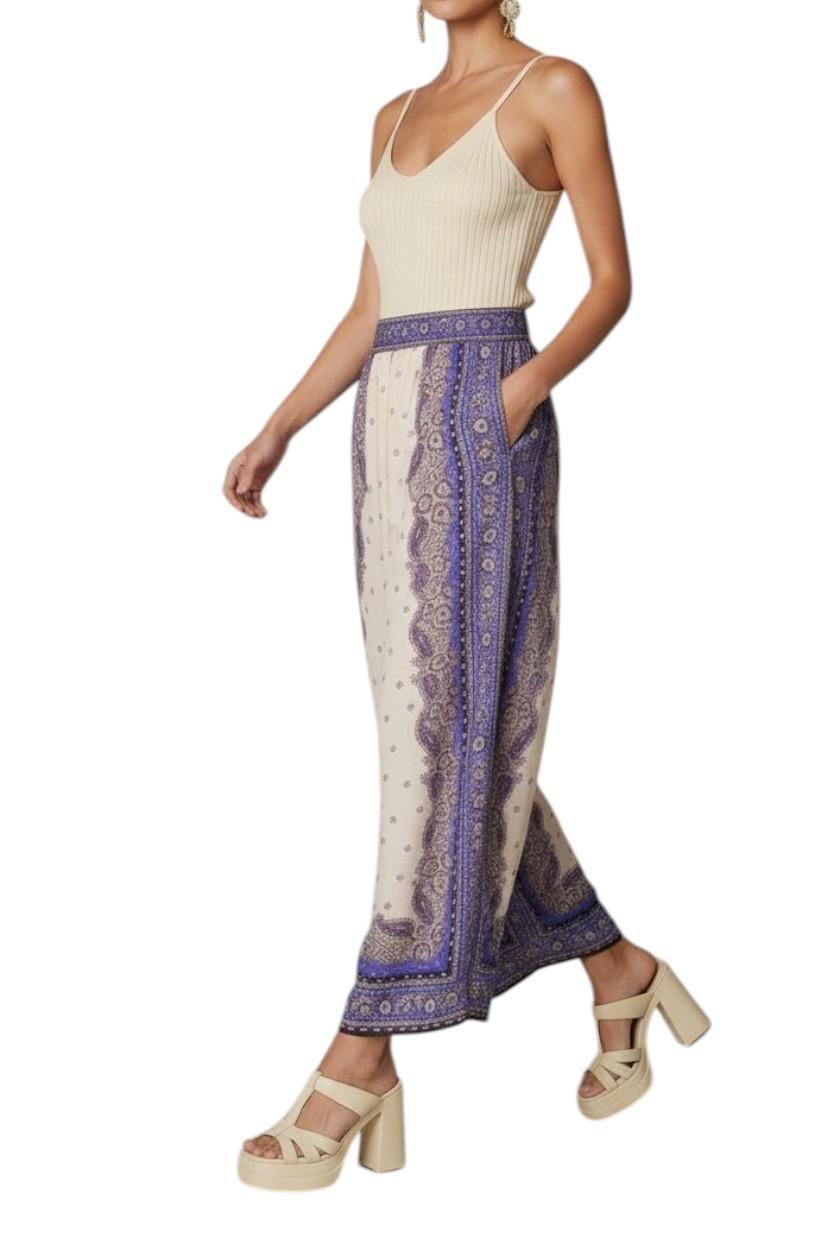 AI generated image of Woman wearing a white sleeveless top and patterned pants on a white background