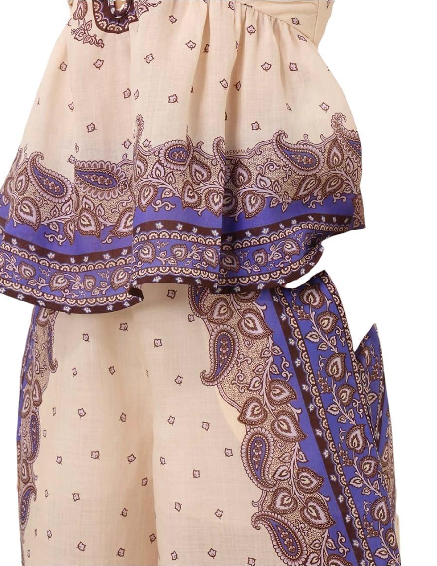 Beige and blue patterned top and pants on a white background