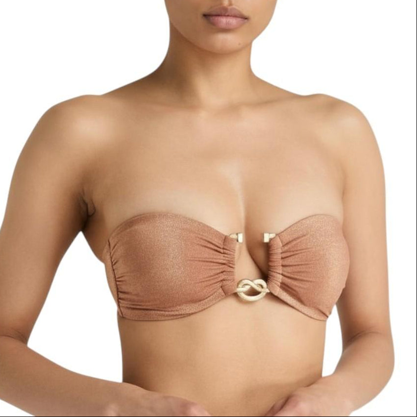 AI generated image of Woman wearing a brown strapless top with a gold clasp on a white background