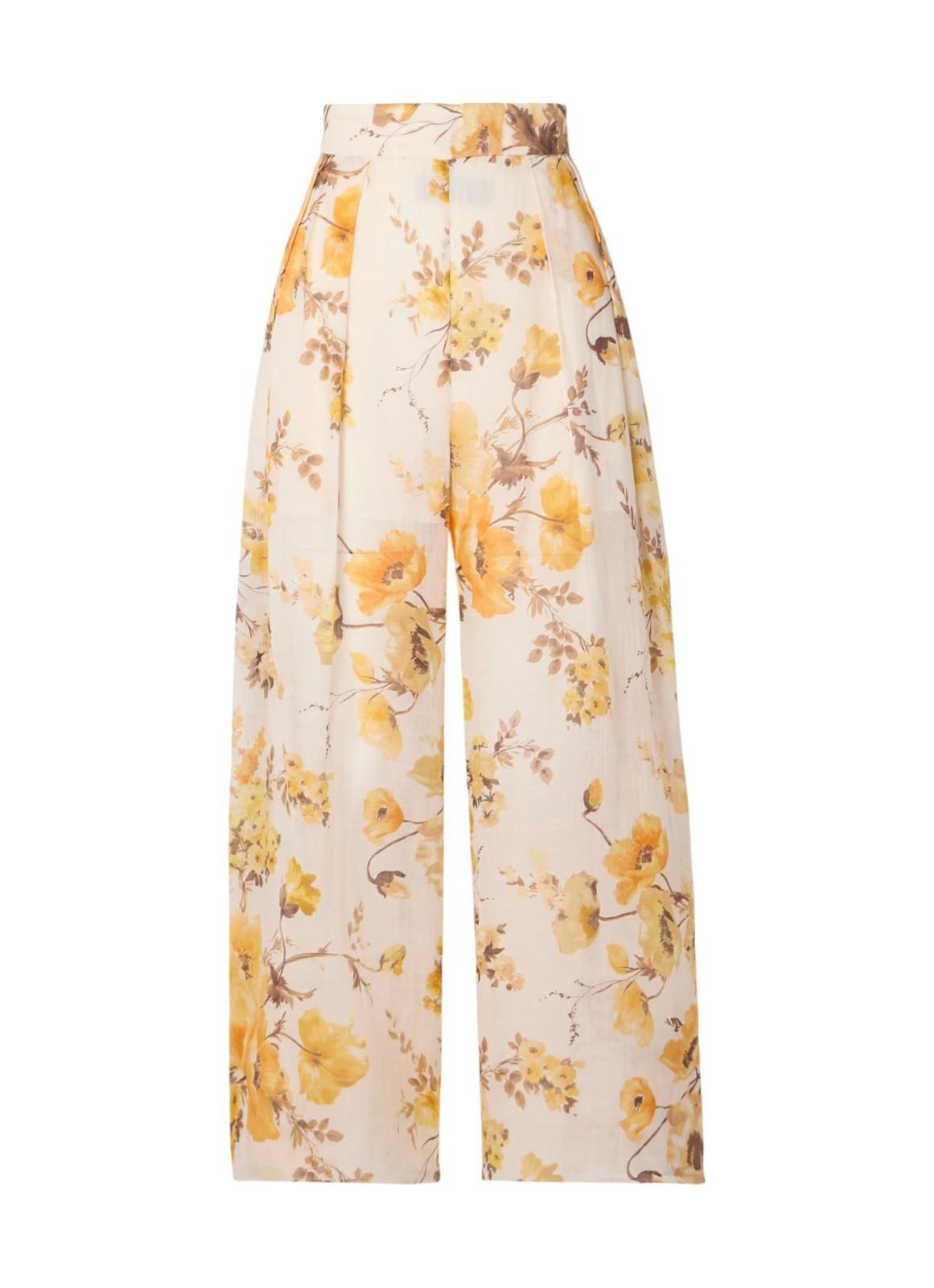 Floral-patterned pants with yellow flowers on a white background