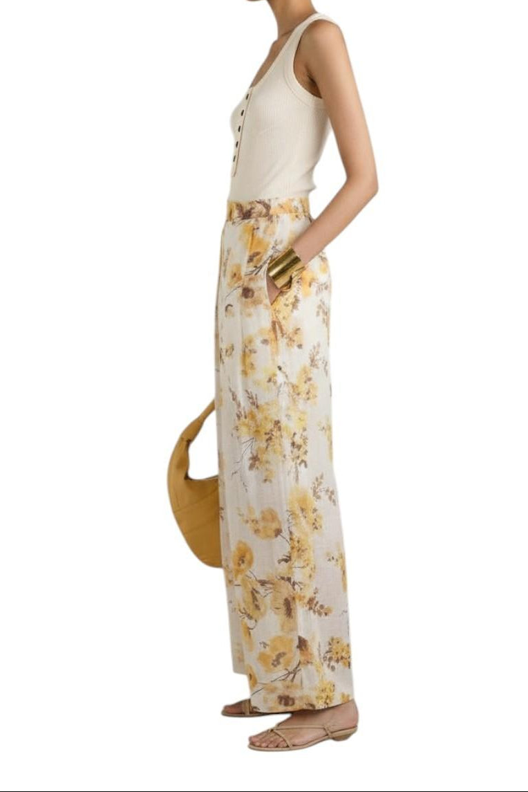 AI generated image of Woman wearing a cream sleeveless top and floral pants, holding a yellow bag on a white background