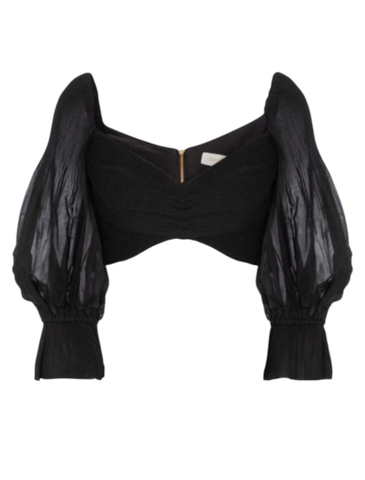 Black crop top with puffed sleeves on a white background