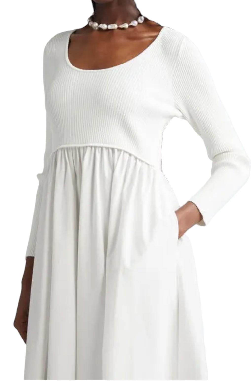 White long-sleeve dress worn by a person on a white background