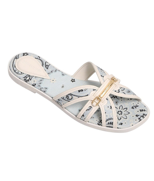 White sandal with floral pattern on a white background