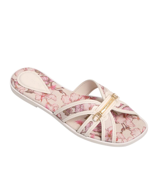 Floral sandal with a gold buckle on a white background