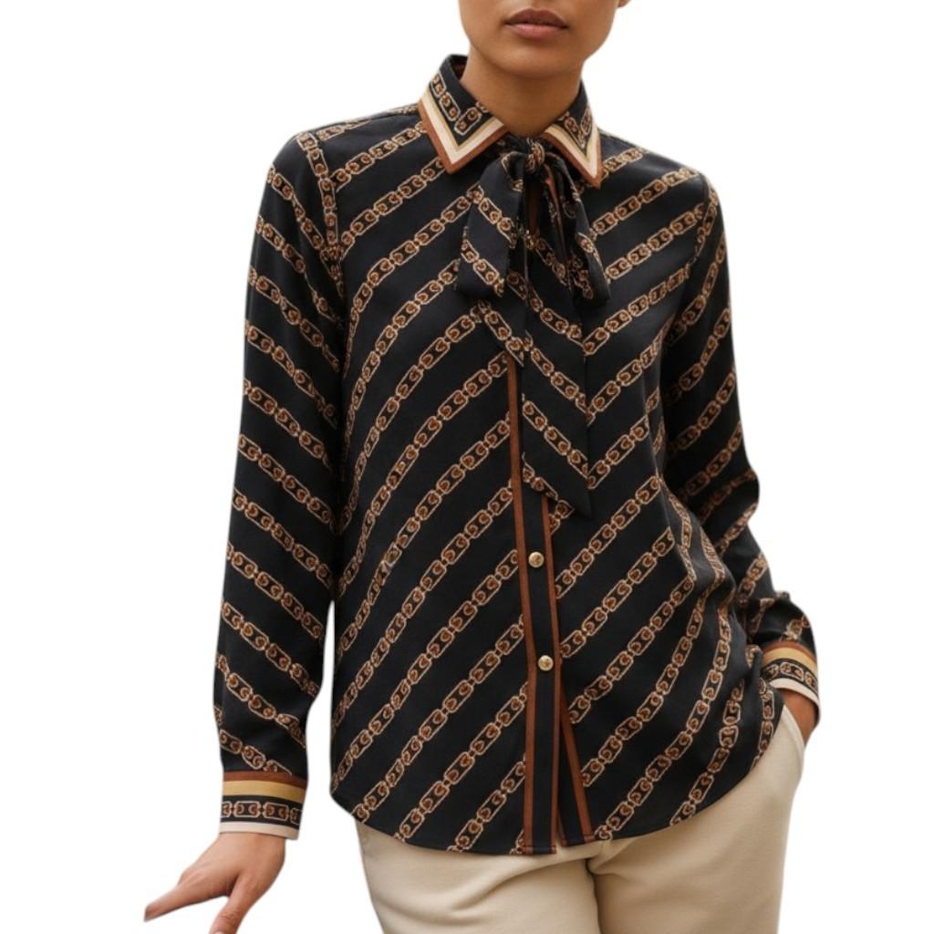 AI generated image of Black and brown patterned blouse worn by a person on a white background