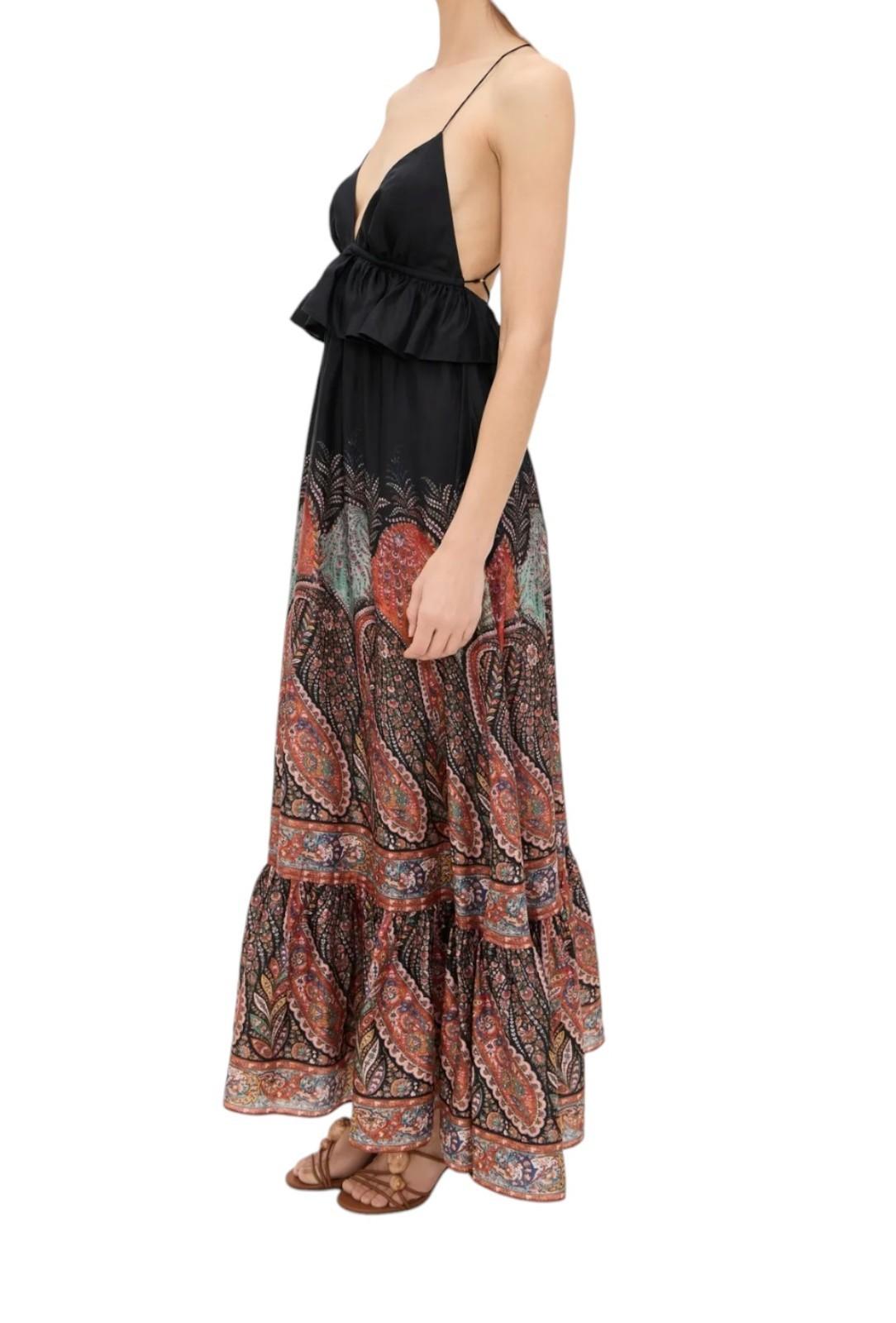 Black top with a patterned long skirt on a white background