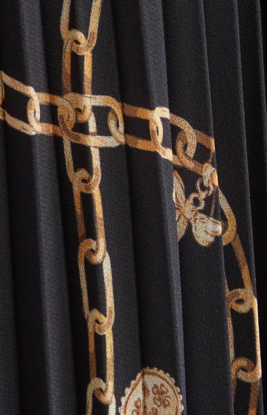 Black fabric with gold chain pattern and logo