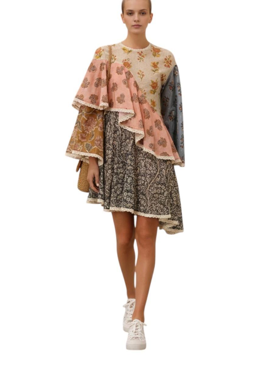 Woman wearing a layered dress with floral patterns on a white background