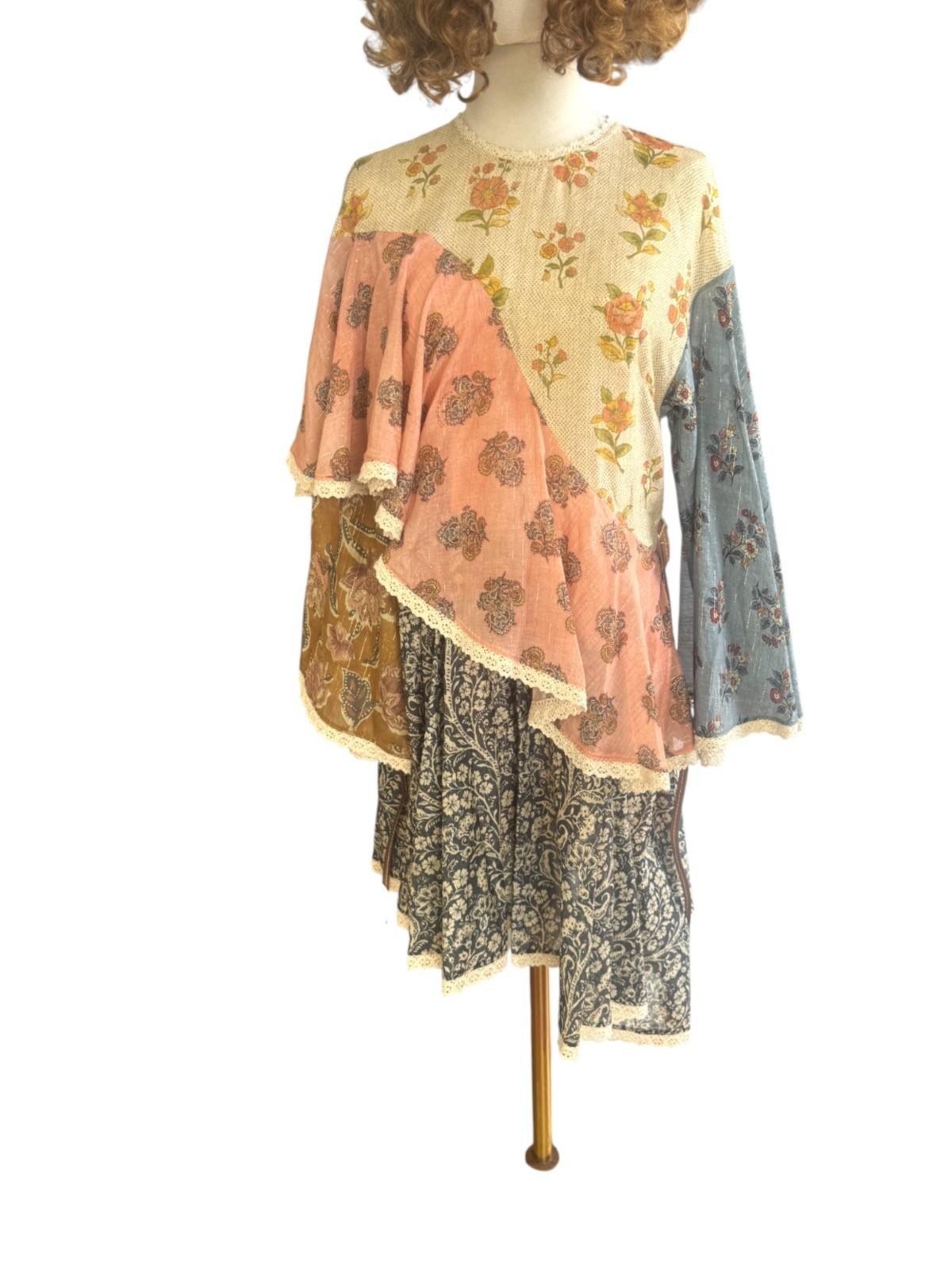 Mannequin wearing a layered outfit with floral patterns on a white background