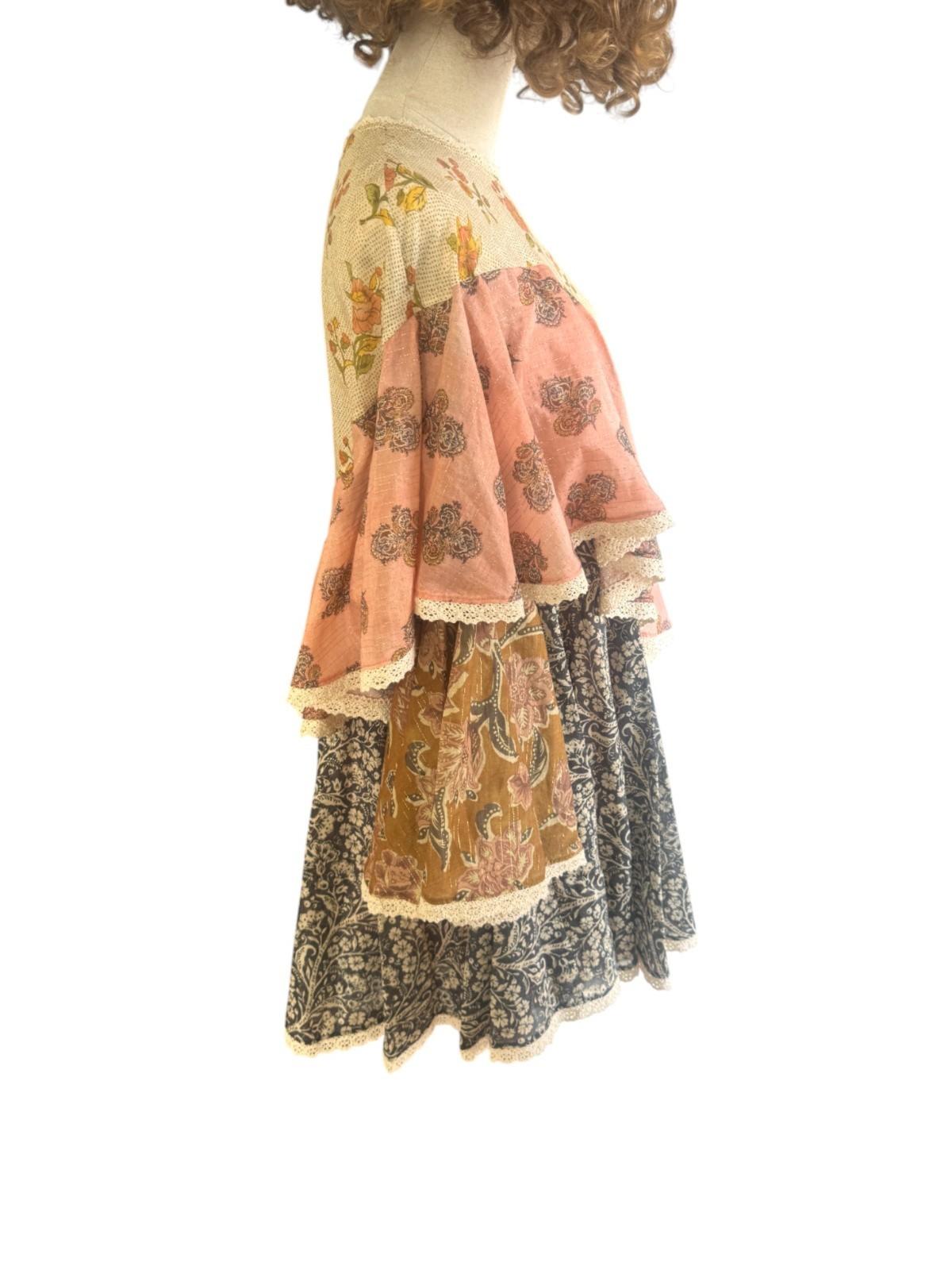 Mannequin wearing a layered outfit with floral patterns on a white background