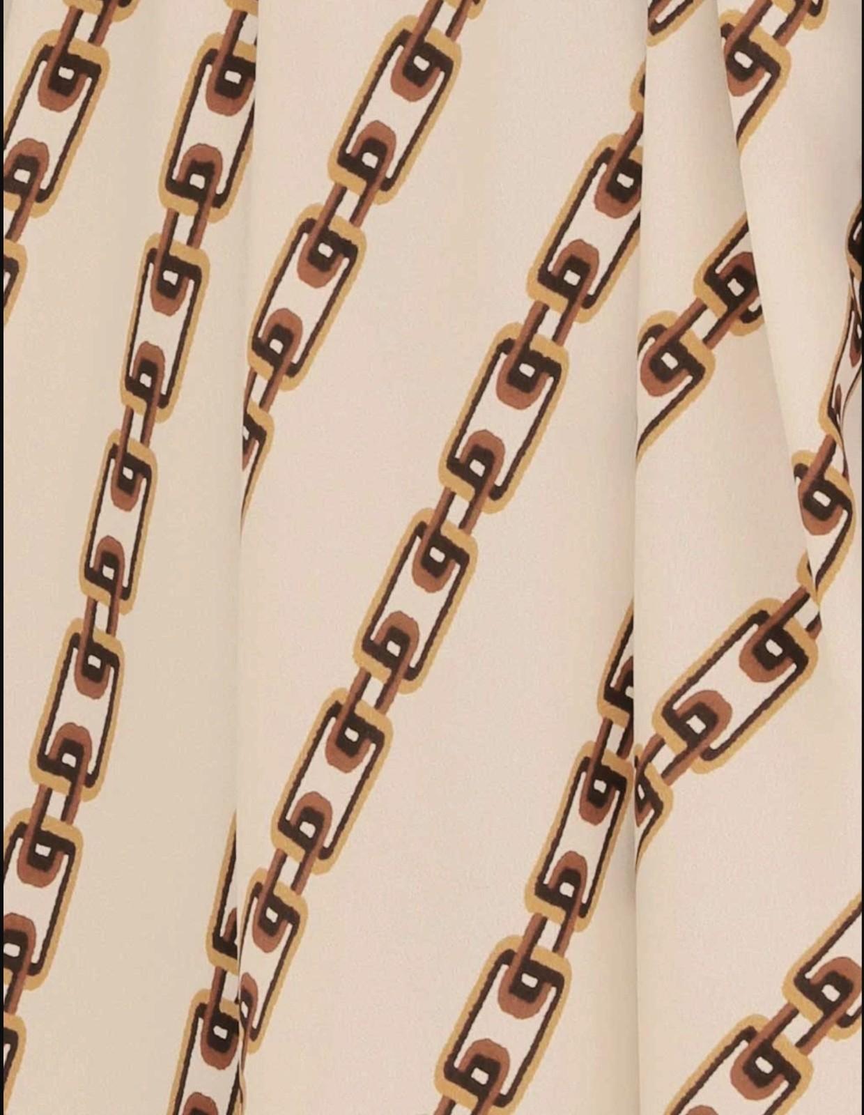 Patterned fabric with chain-like design on a beige background