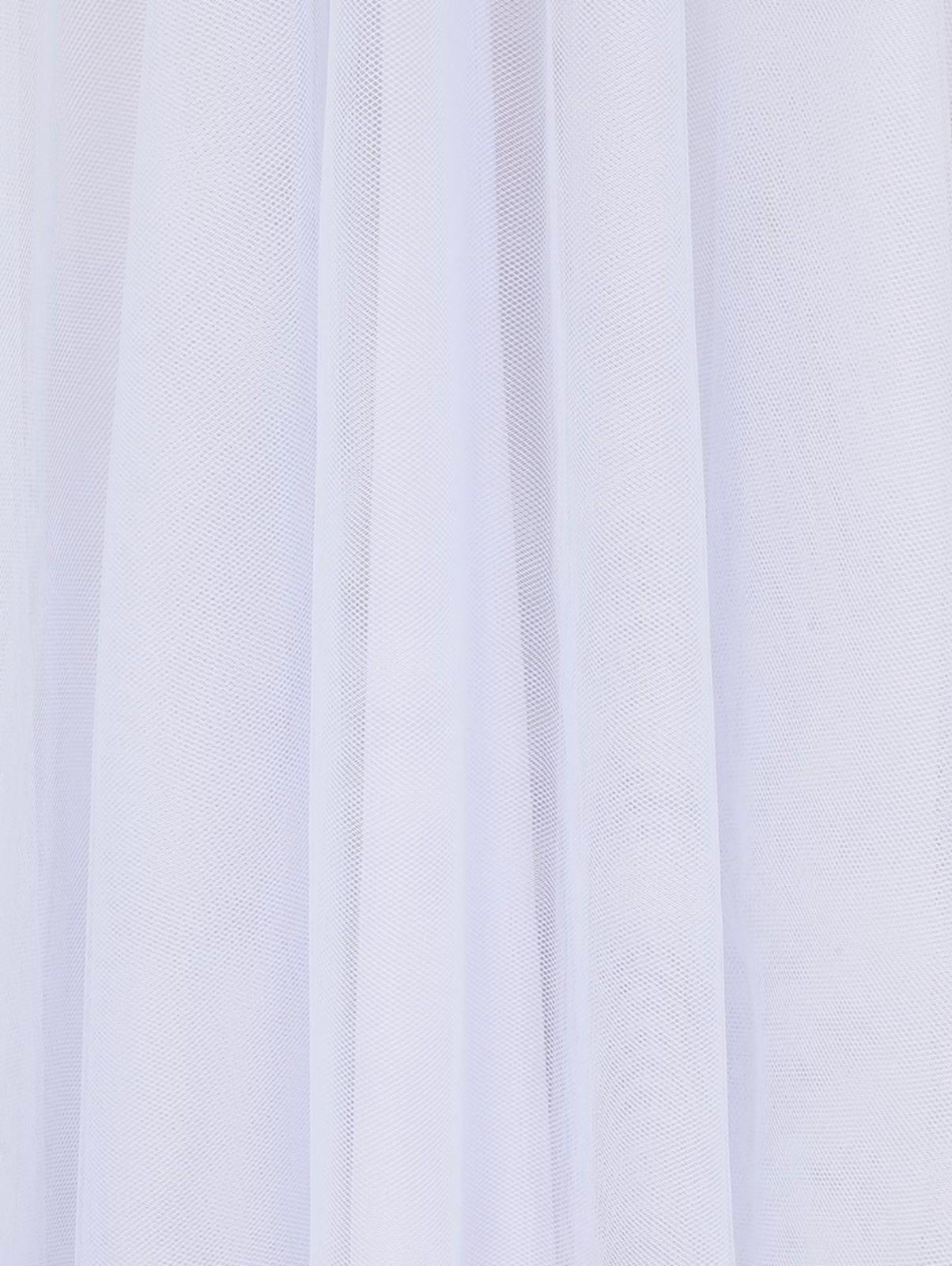 Close-up of a white curtain with folds