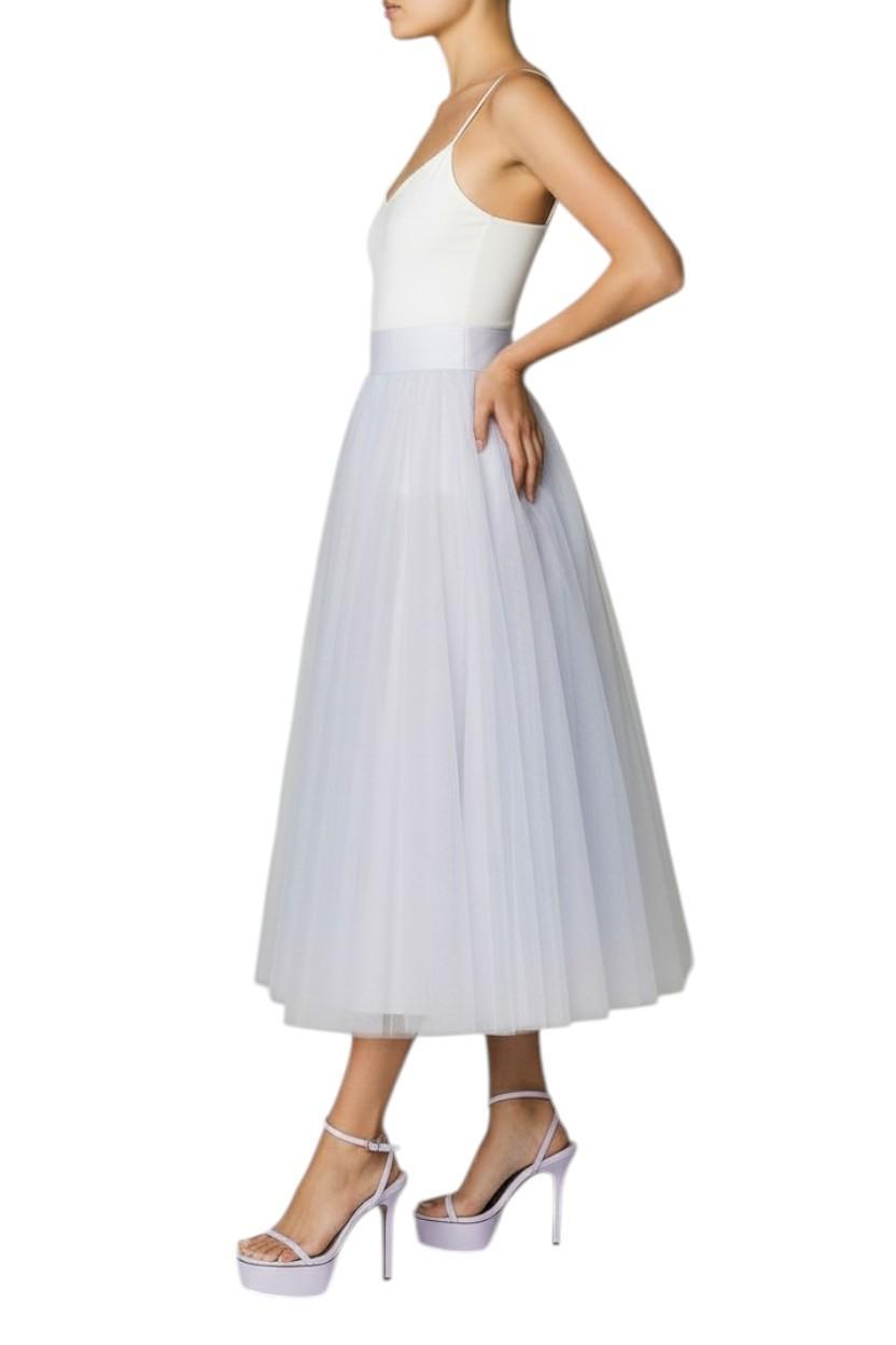 AI generated image of White dress with a tulle skirt worn by a model on a white background
