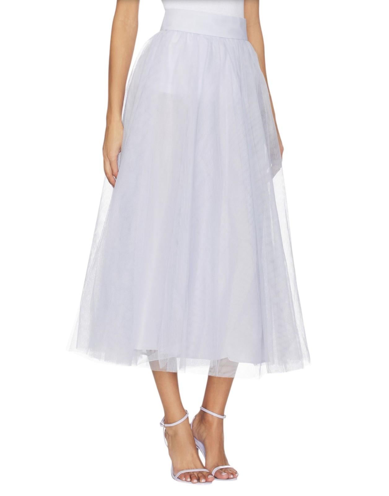 White tulle skirt worn by a person on a white background