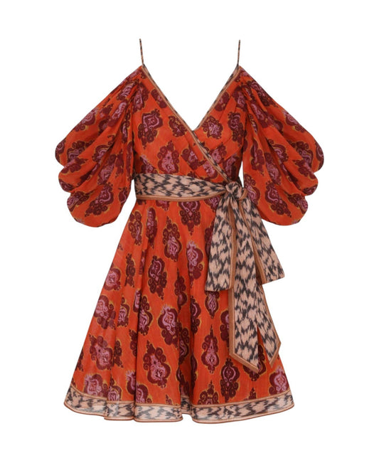 Orange patterned dress with puff sleeves on a white background