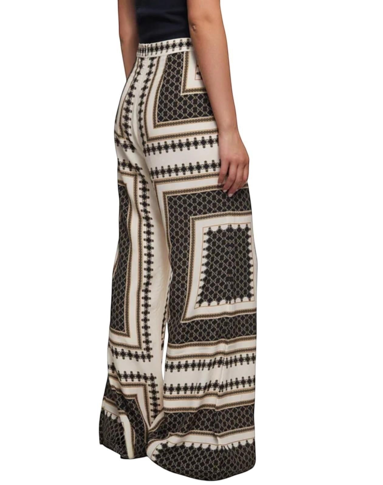 Naked Pear Zimmermann high-waisted flare pants in a black, cream, and brown geometric silk-blend print