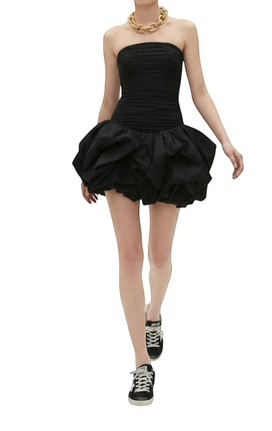 Naked Pear Aje black strapless mini dress with a ruched bodice and voluminous bubble hem worn by a model